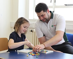 Child playing with an abacus.