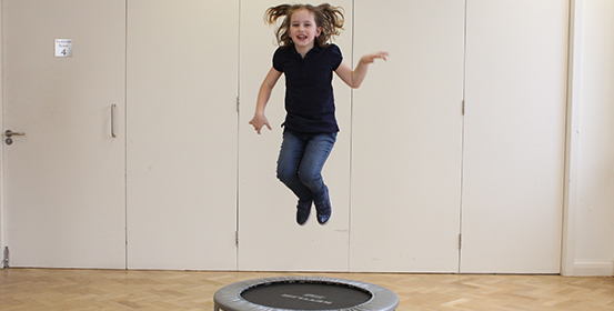 Paediatric ManchesterOT patient playing and jumping around in the St John Streeet clinic.